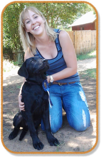happy owner and puppy graduating from class